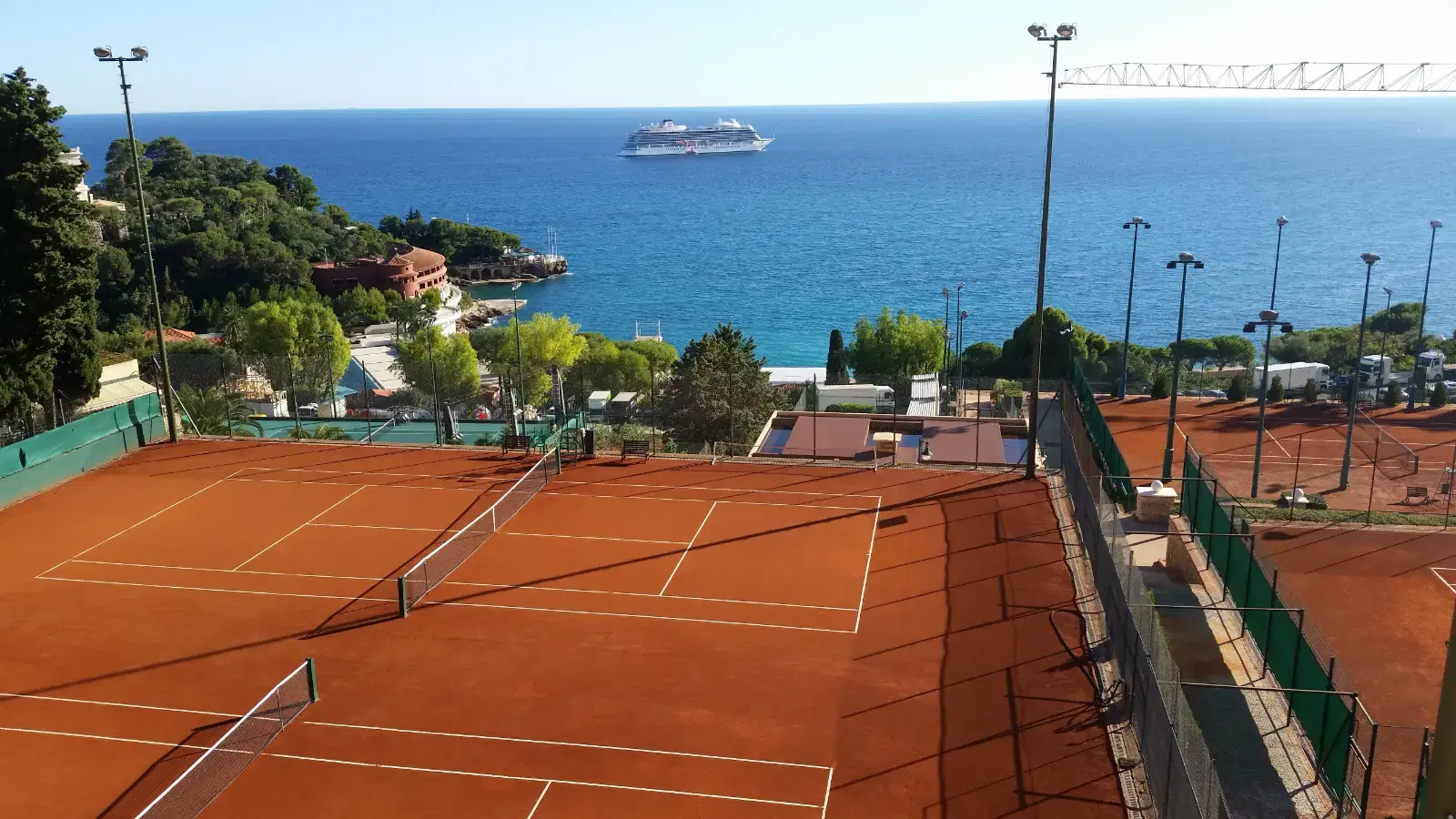 Clay tennis courts at a seaside club